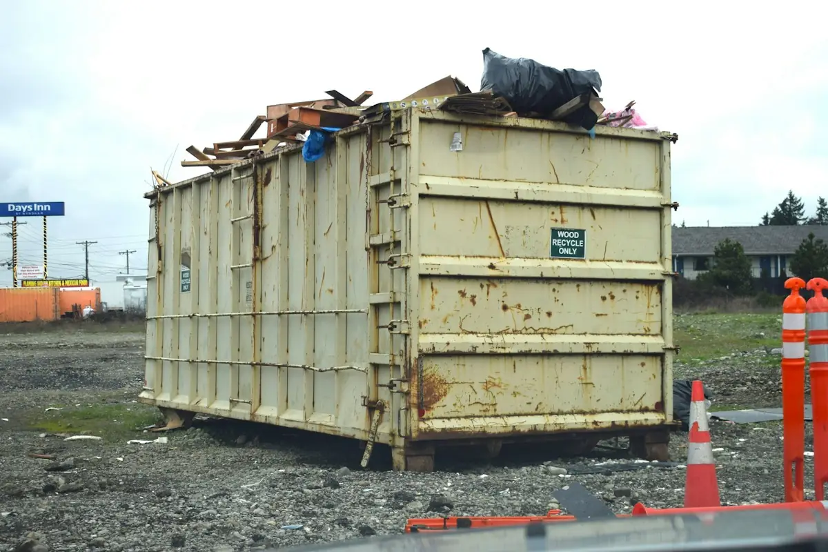 Roll-off dumpster loaded with construction debris
